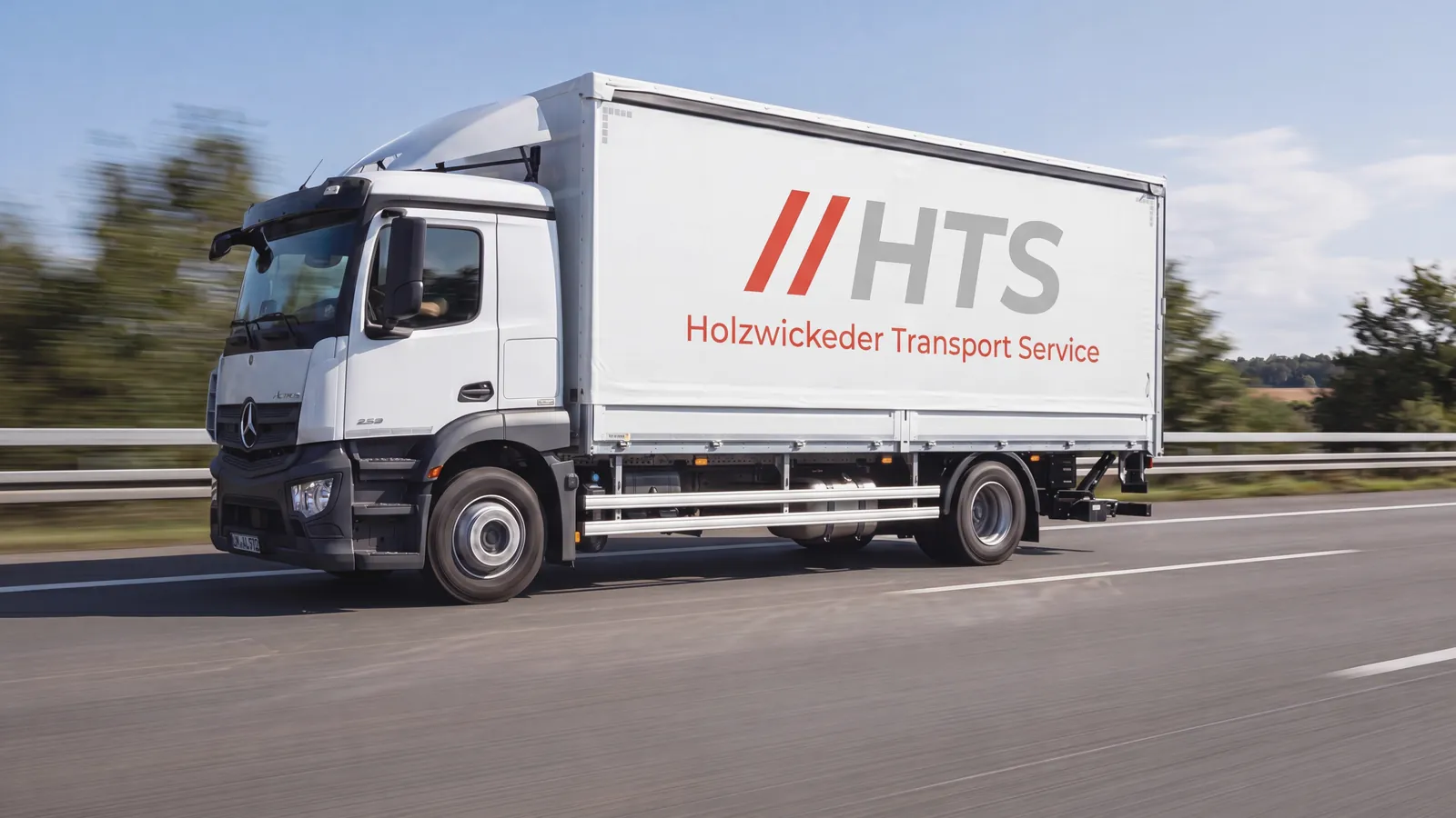 HTS-Lkw mit HTS-Plane auf der Autobahn — Spedition aus Holzwickede